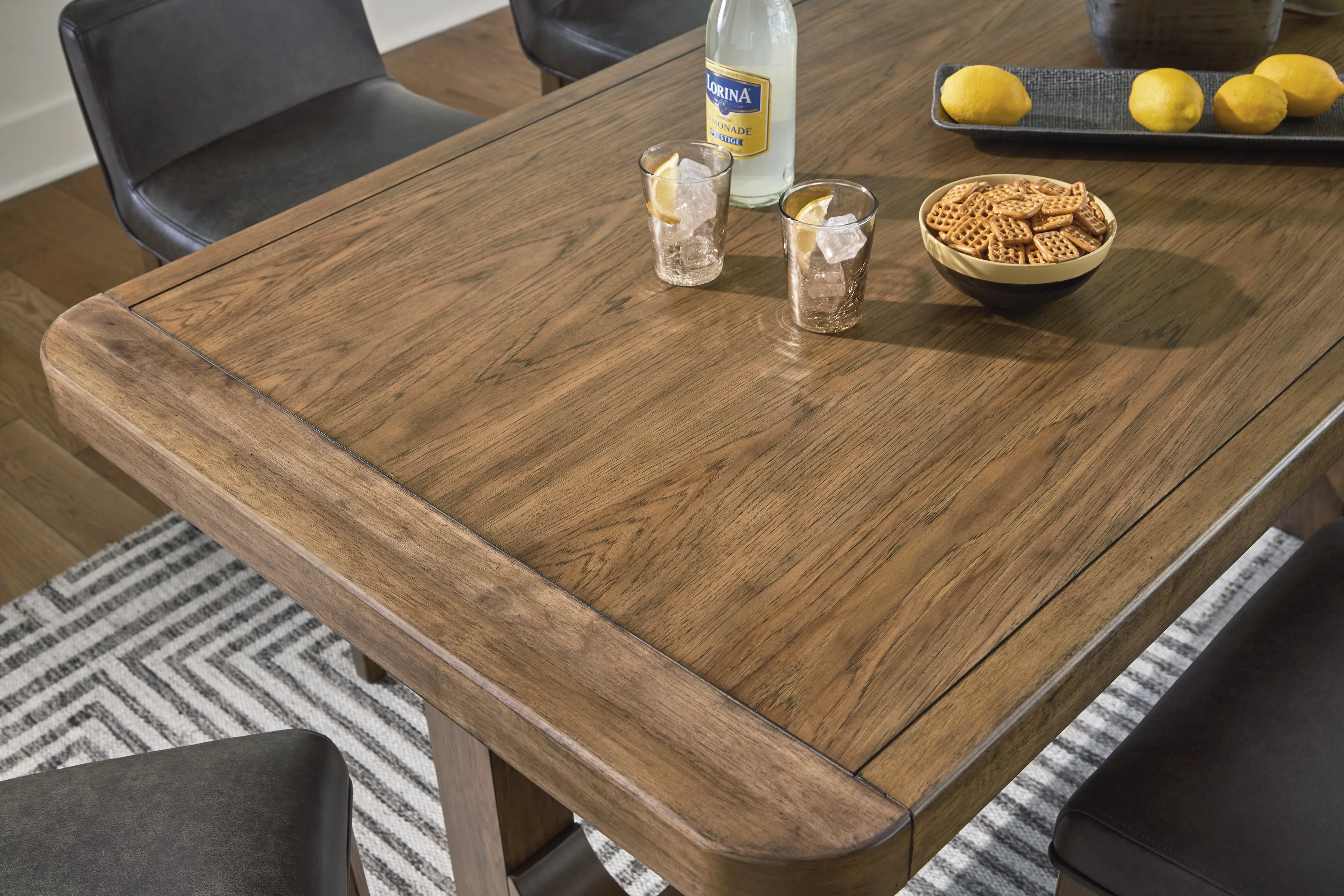 Cabalynn Counter Height Dining Table and 4 Barstools in Light Brown