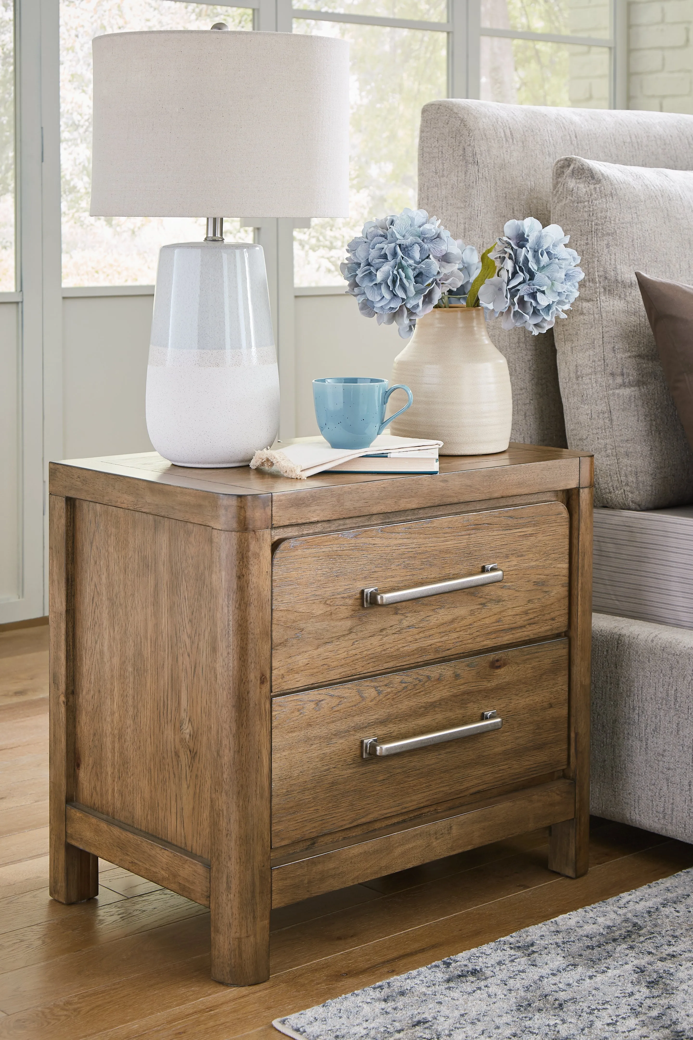 Cabalynn Queen Upholstered Bed with Chest and Nightstand in Light Brown